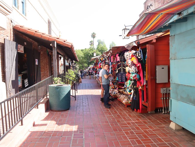 Vibrant Olvera Street marketplace with colorful vendor stalls and traditional Mexican merchandise